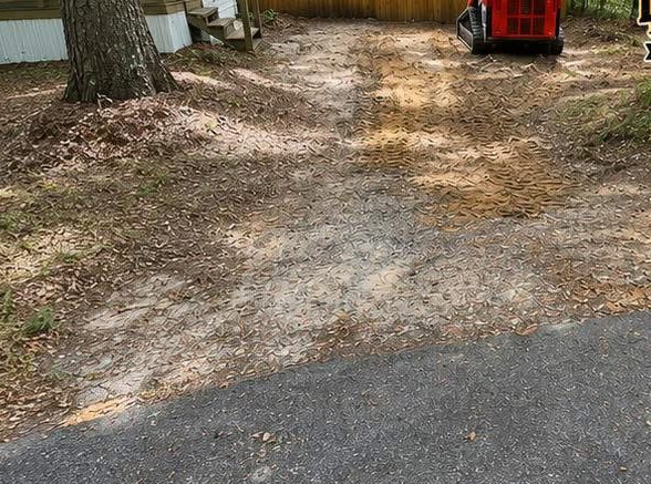 Rutted dirt path before driveway work